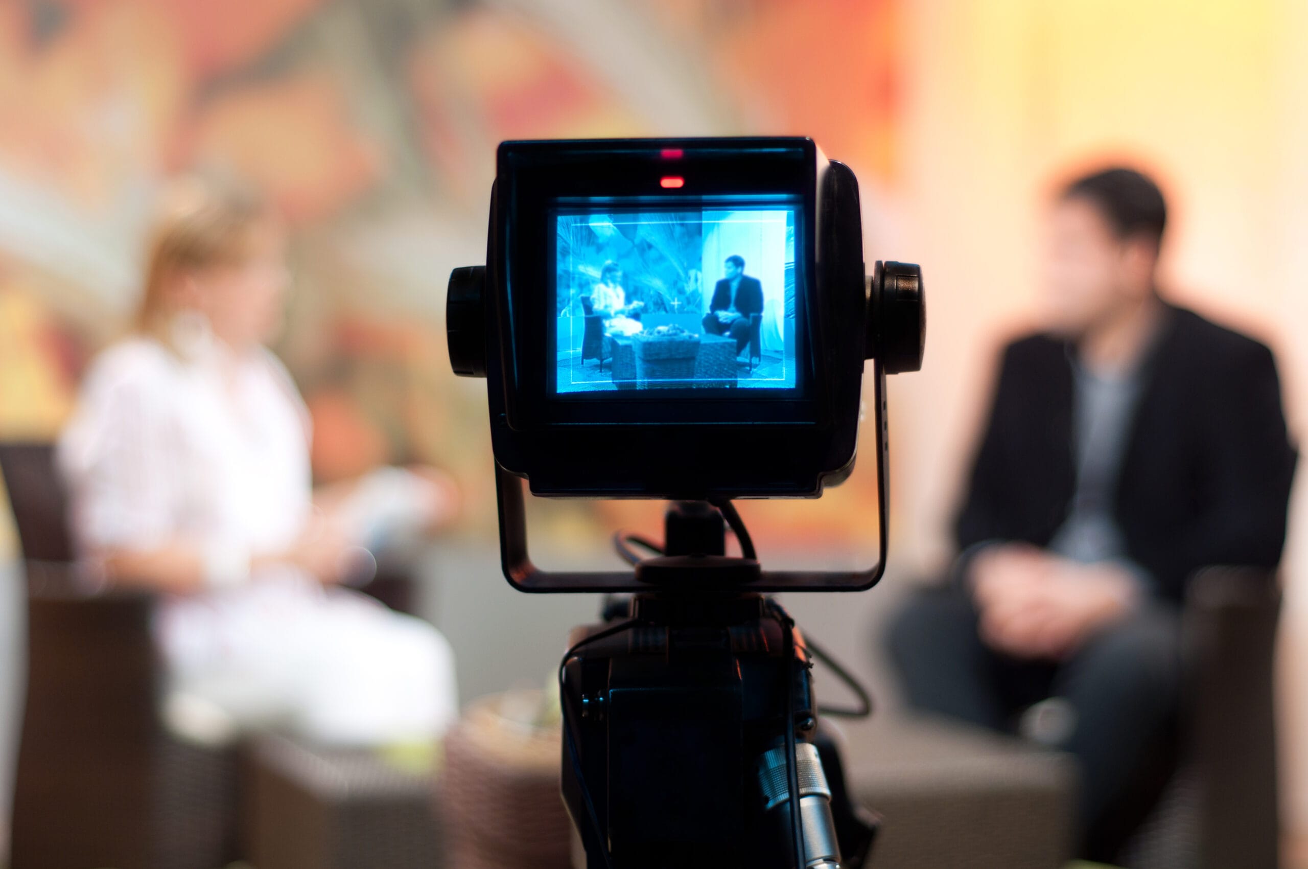 Shallow focus of a Video camera viewfinder, recording show in a TV studio during a talk show Shallow focus of a Video camera viewfinder, recording show in a TV studio during a talk show